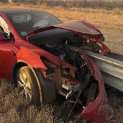 Driver Walks Away With Minor Injuries After His Tesla Gets Skewered By A Guardrail